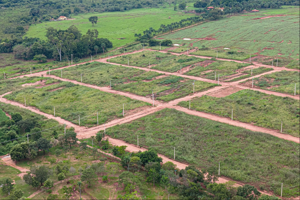 Itaja, Goias, Brazil - 04 13 2024: aerial image of new subdivision for houses, dirt road and power poles